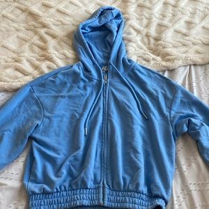 Light blue zip up from H&M barely worn, cropped with a synch at the bottom